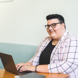 A trans gender identity person at desk